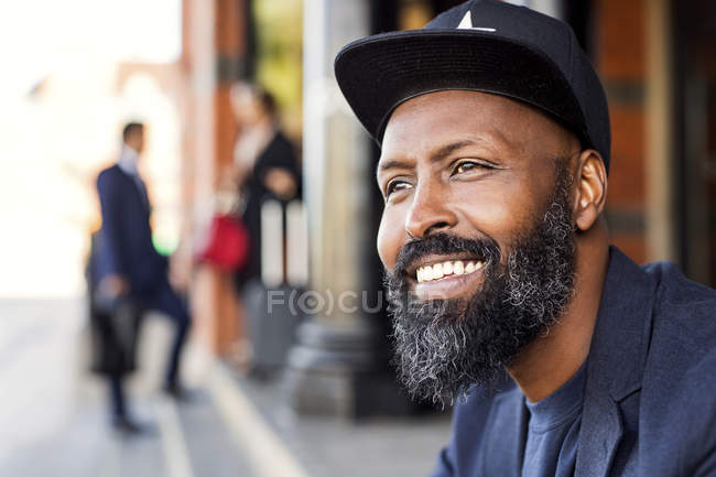 Thoughtful man smiling — Stock Photo