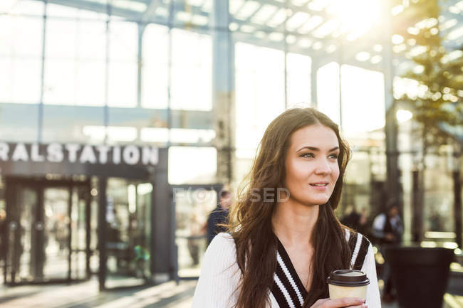 Businesswoman holding disposable cup — Stock Photo