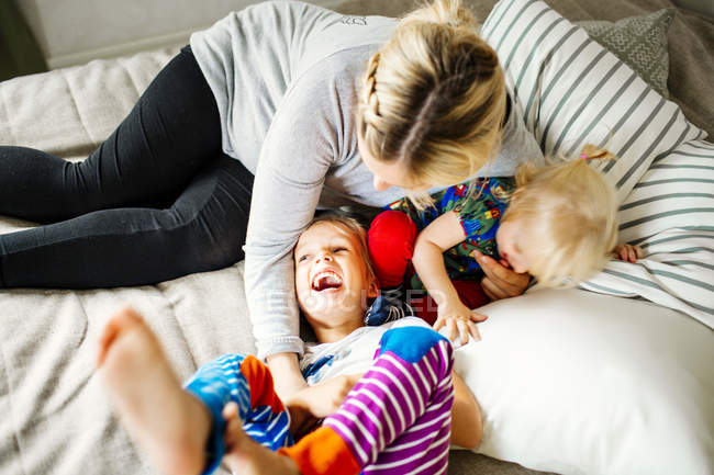 Mother playing with children — Stock Photo