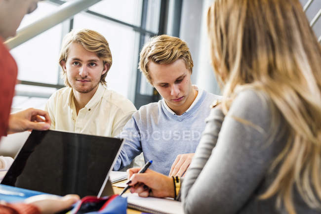 Male student with friends — Stock Photo