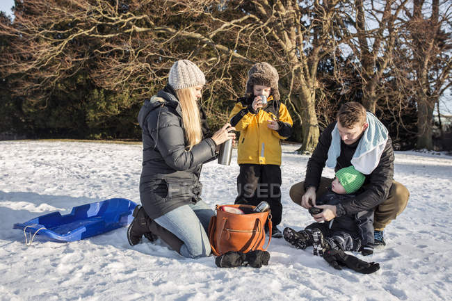 Family having hot chocolate — Stock Photo