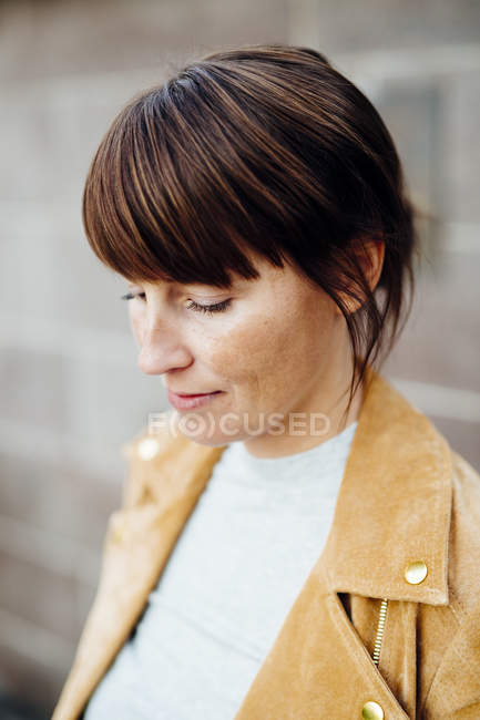 Woman looking down outdoors — Stock Photo