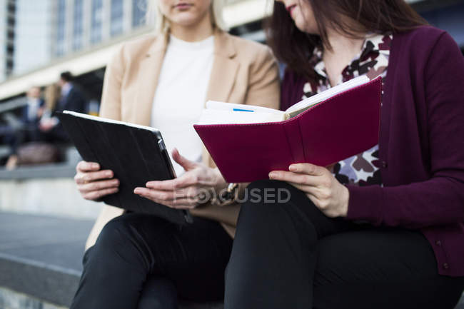 Colleagues holding digital tablet — Stock Photo