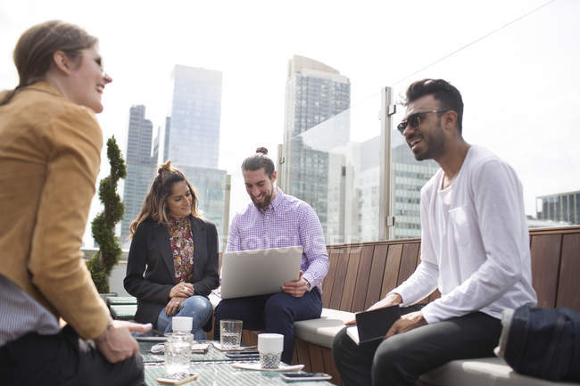 Business people relaxing at rooftop — Stock Photo
