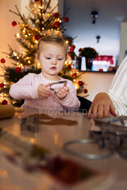 Girl holding pastry cutter — Stock Photo