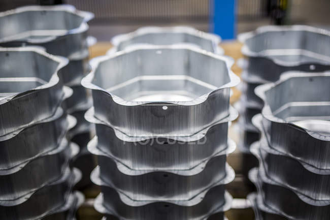 Stack of containers in factory — Stock Photo