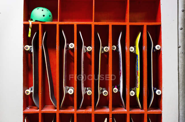 Skateboards arranged in shelf — Stock Photo