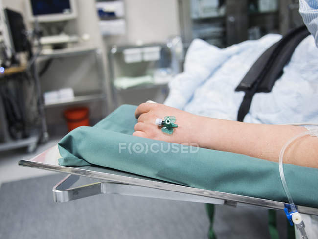 Pregnant woman with drip on hand — Stock Photo