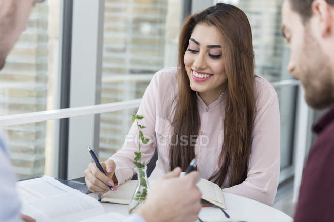 Businesswoman planning with male colleagues — Stock Photo