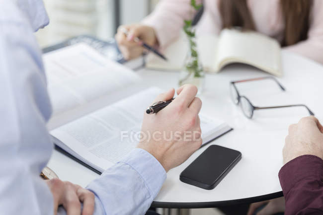 Business people planning on table — Stock Photo