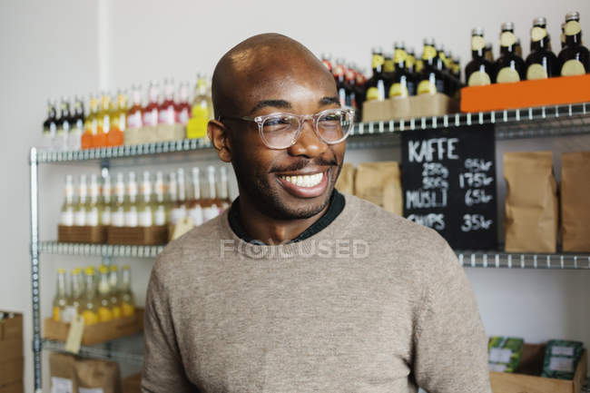 Young man at coffee shop — Stock Photo