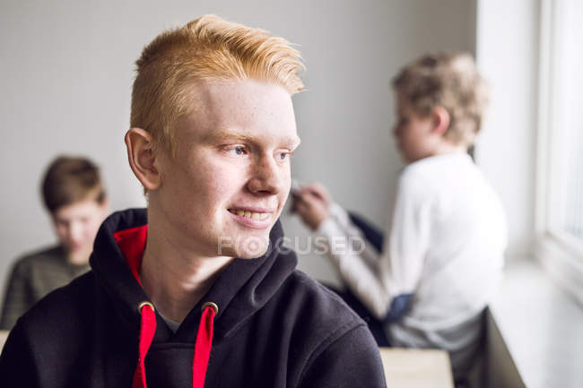 Portrait of schoolboy in classroom — Stock Photo