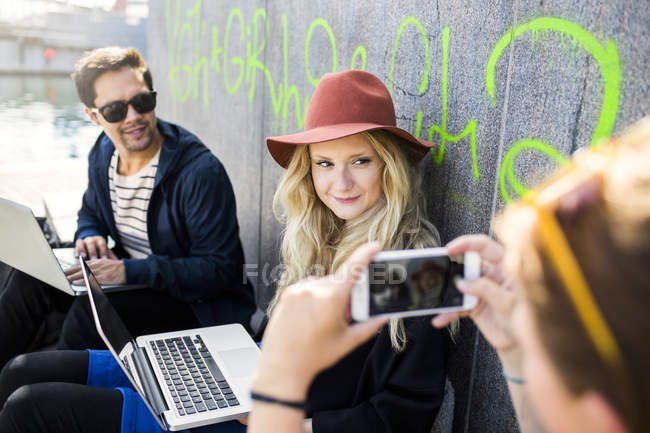 Woman photographing freelancers — Stock Photo