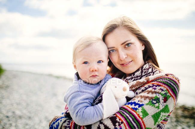Portrait of mother holding son — Stock Photo