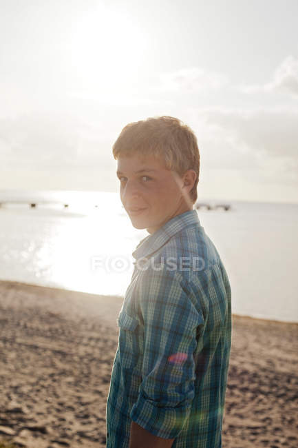 Portrait of teenage boy at beach — Stock Photo