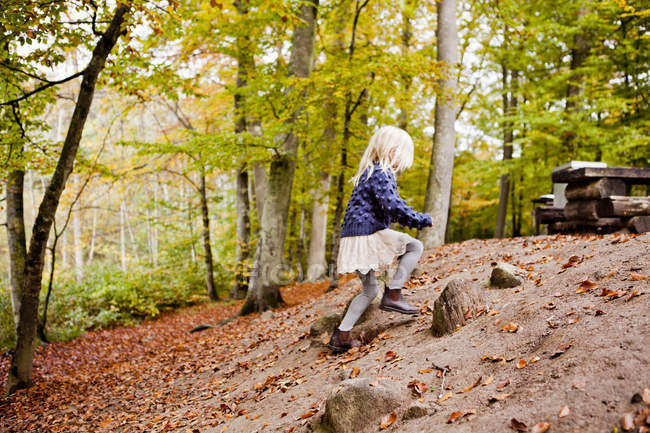 Girl running in forest — Stock Photo