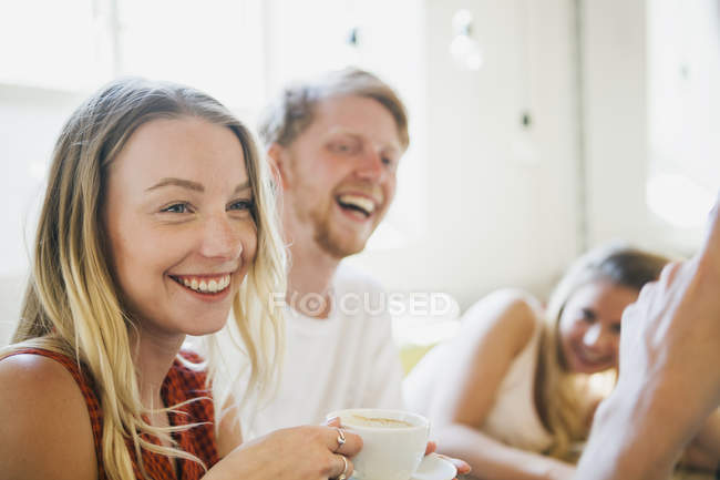 Happy friends with coffee — Stock Photo