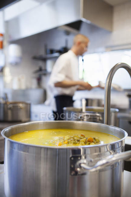 Food in utensil with chef — Stock Photo