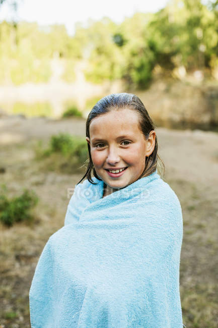 Girl wrapped in towel — Stock Photo