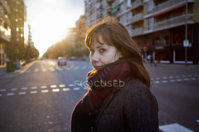 Woman wearing warm clothing on road — Stock Photo
