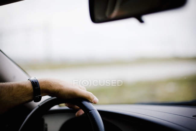 Cropped hand driving car — Stock Photo