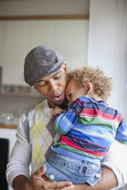 Father carrying son — Stock Photo