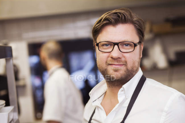 Confident chef at commercial kitchen — Stock Photo