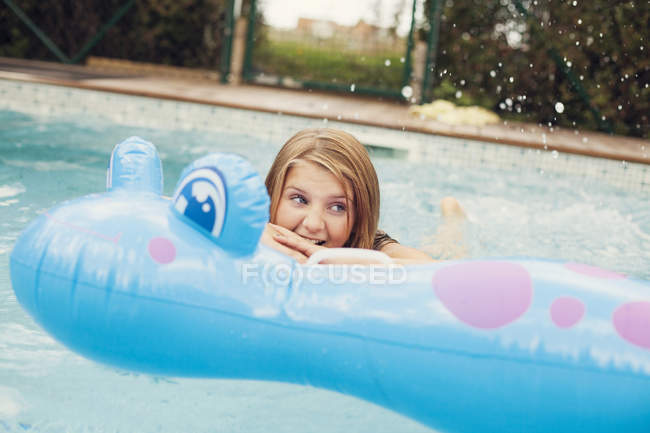Happy girl swimming — Stock Photo
