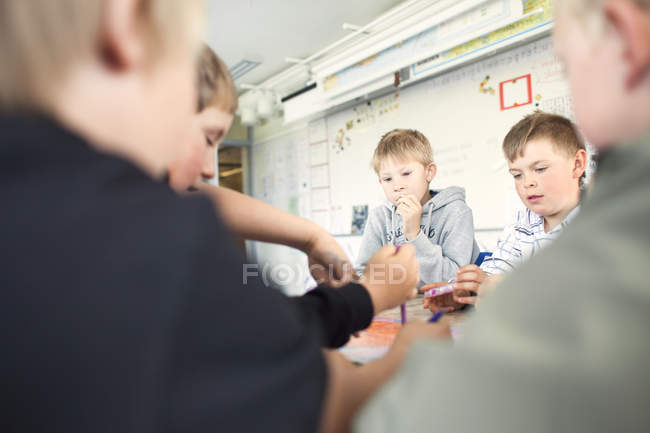 Elementary boys studying together — Stock Photo
