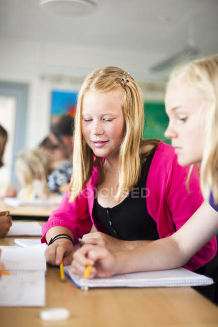 Junior high schoolgirls studying — Stock Photo