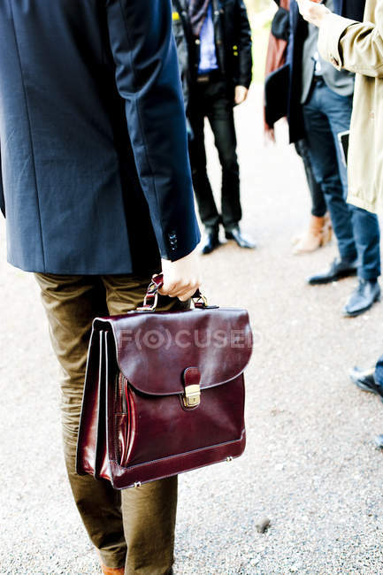 Businessman carrying briefcase — Stock Photo