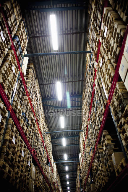 Crates in shelves in warehouse — Stock Photo