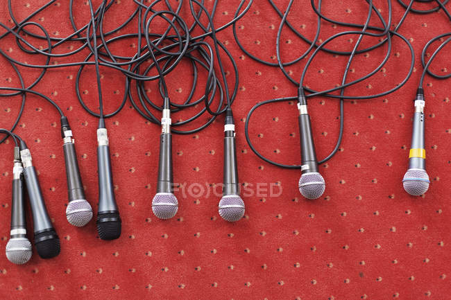 Microphones on stage on red carpet — Stock Photo