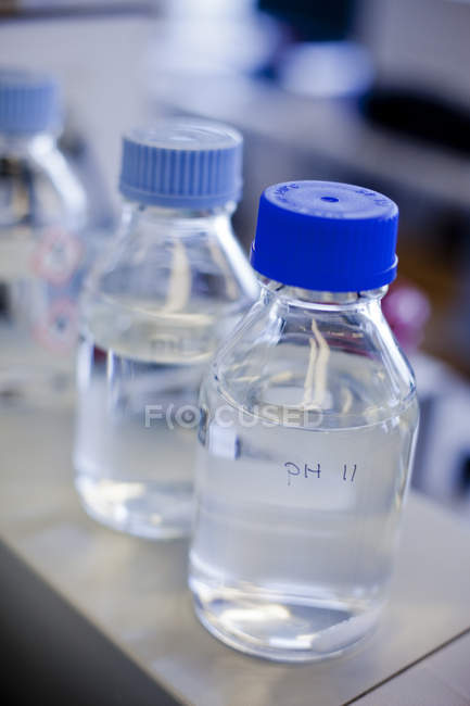 Chemical bottles on table — Stock Photo