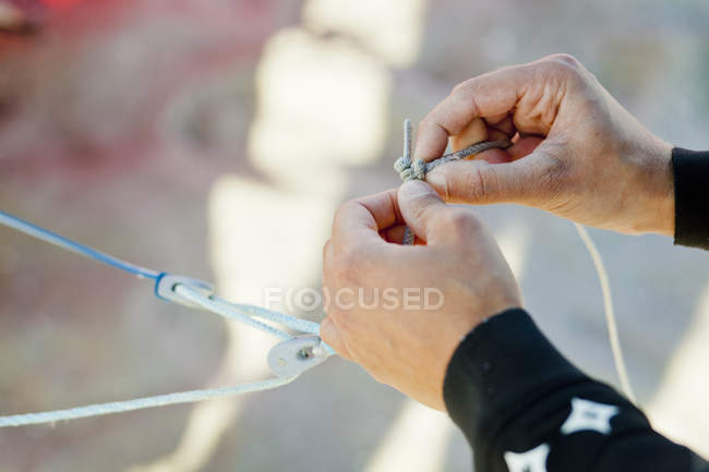 Midsection of man holding strings — Stock Photo