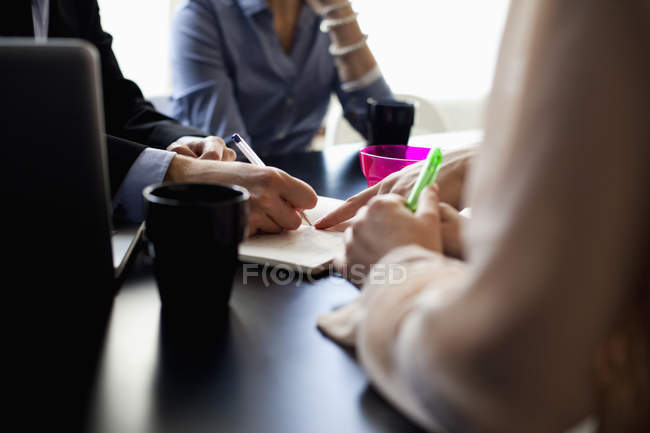 Midsection of business people discussing — Stock Photo
