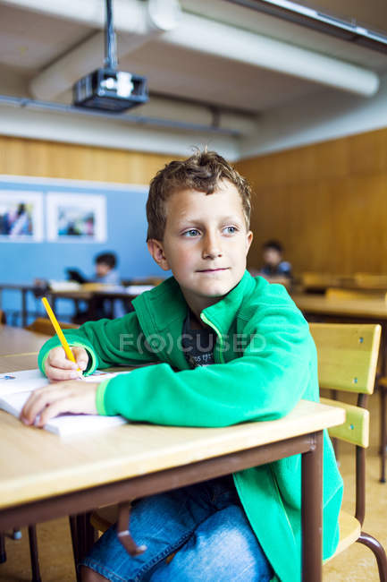 Thoughtful schoolboy looking away — Stock Photo
