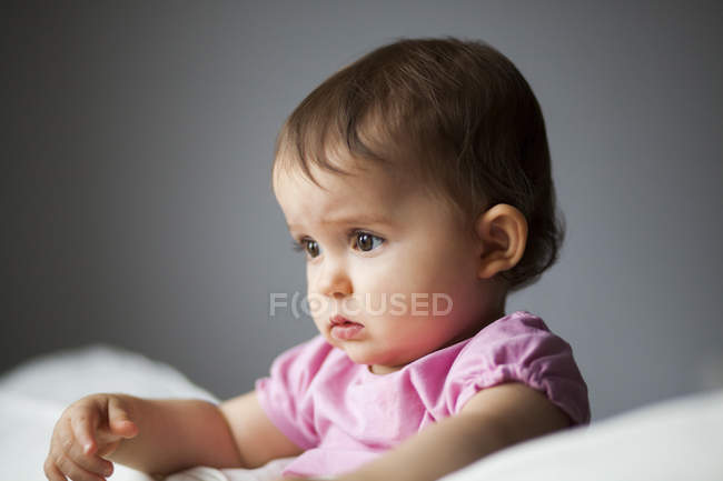 Cute baby girl in crib — close up, headshot - Stock Photo | #154364278