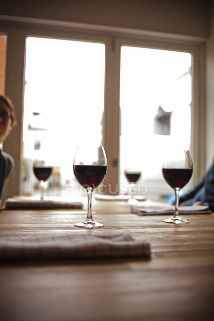 Red wine glasses on restaurant table — Stock Photo