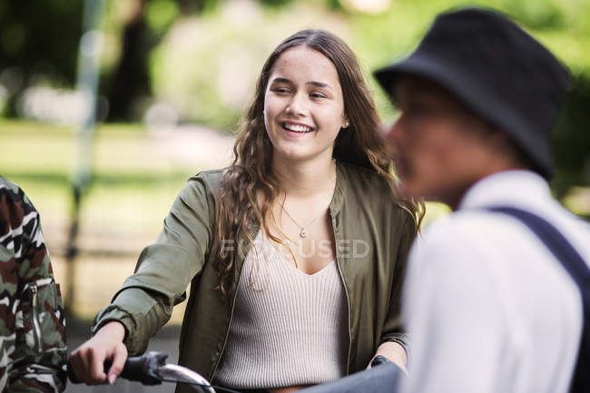 Students smiling, standing outdoors — Stock Photo