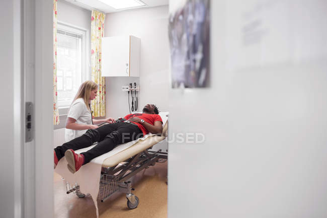 Young man with doctor — Stock Photo