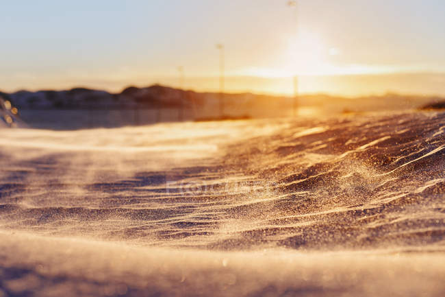 Snow covering surface at sunset — Stock Photo