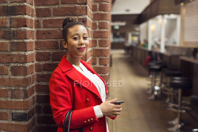 Woman in red coat — Stock Photo