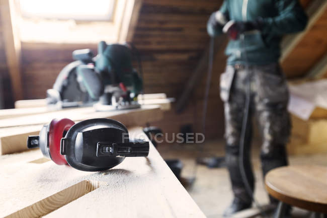 Man plugging in power tool — Stock Photo