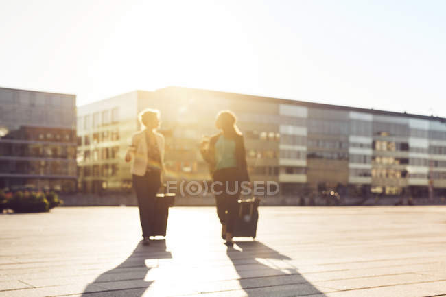 Businesswomen walking outdoors — Stock Photo
