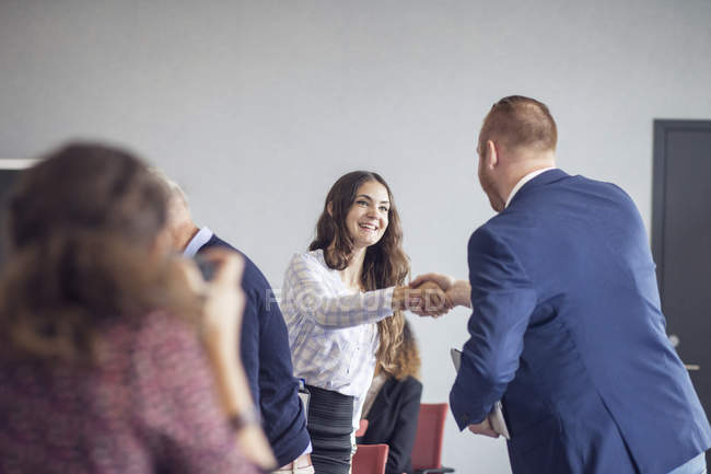 Colleagues shaking hands — Stock Photo