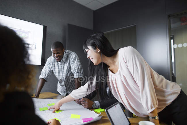 Architects discussing blueprint — Stock Photo