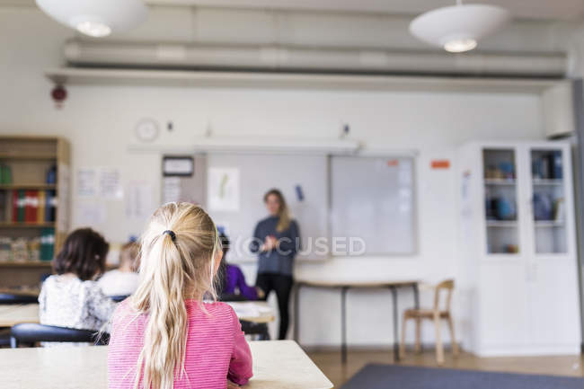 Girls learning in classroom — Stock Photo