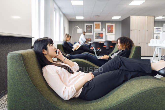 Colleagues sitting in modern office — Stock Photo