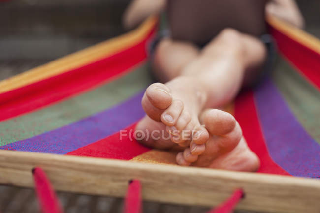 Low section of woman using laptop on hammock — Stock Photo